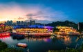 Scenic view of Clarke Quay with Bumboat cruising in Singapore River Royalty Free Stock Photo