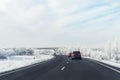 Scenic view clean intercity highway road drive cars with beautiful white covered snow trees blue sky on background at