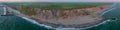 Scenic view of the cliffs at the danish coast with the red lighthouse Bovbjerg Fyr. Panoramic aerial view of beautiful nature land