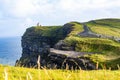 Scenic view of the Cliffs of Moher and O\'Brien\'s Tower at sunrise Royalty Free Stock Photo