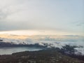 Scenic view of clouds and mist at sunrise from the top of mount Batur Kintamani volcano , Bali, Indonesia. Royalty Free Stock Photo