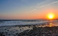 Scenic view of coastline at sunset.