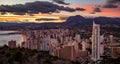 Scenic view of the coastline town Benidorm under cloudy pinky sunset sky, Spain Royalty Free Stock Photo