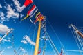Scenic view of colorful flags hanging on ropes of a mast in blue sky background Royalty Free Stock Photo