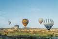 scenic view of colorful hot air balloons flying over valley of Royalty Free Stock Photo