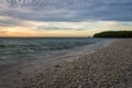 A scenic view of coral beach with beautiful sunset or sunrise sky on the background Royalty Free Stock Photo