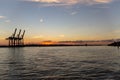 Scenic View of cranes at Hamburg Harbour durng sunset hour Royalty Free Stock Photo