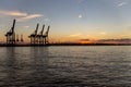 Scenic View of cranes at Hamburg Harbour durng sunset hour Royalty Free Stock Photo