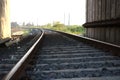 scenic view of curved railway tracks disappearing into the distant horizon