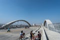 Scenic view of cyclists passing over the Los Angeles bridge