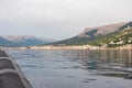Baska - Scenic view from dinghy boat of idyllic coastal town Baska, Krk Island, Primorje-Gorski Kotar, Croatia, Europe Royalty Free Stock Photo