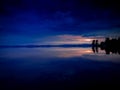 Scenic view of a dramatic sky reflecting in a tranquil lake during nighttime Royalty Free Stock Photo