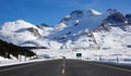 Scenic view of an empty asphalt road leading across scenic Banff National Park Royalty Free Stock Photo