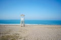 Scenic view of empty bay watch tower on a lonely seaside beach. Scenery landscape of a sea ocean shore with wooden Royalty Free Stock Photo