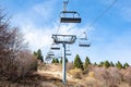 Empty ski lift over a lush hillside Royalty Free Stock Photo