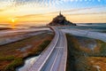 Scenic view of an empty highway leading to Mont Saint Michel on a sandy island in Normandy, France Royalty Free Stock Photo