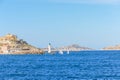 A scenic view of the entrance of the port of Marseille, bouches-du-rhone, France under a majestic blue sky