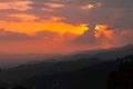 Scenic view of an epic sunset over green mountain forests in Himachal Pradesh, India