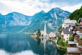 Scenic view of famous Hallstatt lakeside town reflecting in Hallstattersee lake in the Austrian Alps on a sunny day in summer, Royalty Free Stock Photo