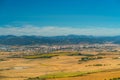 Scenic view featuring Pamplona city and yellow crop fields