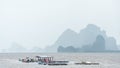 Scenic view of the fishing boats, sea, and island mountains in Phang Nga Bay, Phuket, Thailand. Royalty Free Stock Photo