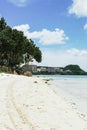 Scenic view of fluffy white clouds over sandy Tumon Beach, Guam, USA Royalty Free Stock Photo