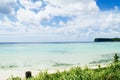 Scenic view of fluffy white clouds over sandy Tumon Beach, Guam, USA Royalty Free Stock Photo