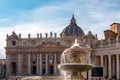 Rome - Scenic view on the fountain on St Peter square with Saint Peter Basilica in the Vatican City, Rome Royalty Free Stock Photo