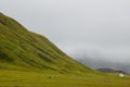 Scenic view of a green mountainous landscape on a cloudy sky background, Iceland Royalty Free Stock Photo