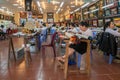 Scenic view of a group of worker doing hand-stitching Vietnam embroidery on the fabric