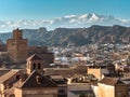 Scenic view of Guadix, Spain with castle, cave houses, and mountains Royalty Free Stock Photo