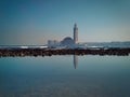 Scenic view of Hassan II mosque Reflected on water on a sunny day Royalty Free Stock Photo