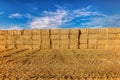 Hay bales on wheat field in Provence against dramatic blue sky in summer Royalty Free Stock Photo