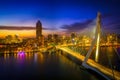 Scenic view of highrise buildings and city skyline with lights during dusk Royalty Free Stock Photo