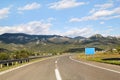 Scenic view on highway road leading through in Croatia, Europe / Electrical transmission towers, sky and clouds in background. Royalty Free Stock Photo