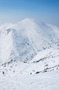 Scenic view of the hill from the top of the mountain and country ski tracks. Royalty Free Stock Photo