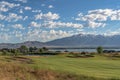 Scenic view of homes golf course pond lake and mountain on a sunny day Royalty Free Stock Photo