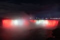 Scenic view of Horseshoe Falls illuminated with lights in Niagara Falls in Ontario, Canada, at night Royalty Free Stock Photo