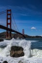 Scenic view of the iconic Golden Gate Bridge near crashing waves in San Francisco, California Royalty Free Stock Photo