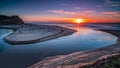 Scenic view of an inlet with a picturesque sunrise sky in the hori