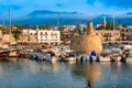 Scenic view of Kyrenia Girne harbour with mountains on backgro