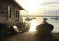 a picturesque view of lake Ammersee in Herrsching (Germany) with a boat house and a couple of sailing boats