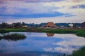 Scenic view of lake by buildings against sky