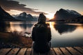 Scenic View of a Lake, Mountains, and Sunset Woman Seated on Dock. AI Royalty Free Stock Photo