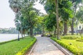 Scenic view of the lakeside of Hoan Kiem Lake, people can seen relaxing and exploring around it.