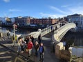 A scenic view of the landmark Hapenny Bridge spanning over the Liffey River in Dublin, Ireland. Royalty Free Stock Photo