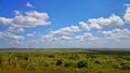 Scenic view of landscape with clouds in sunny day. Royalty Free Stock Photo