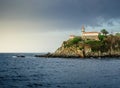 Scenic view of the lighthouse of Cudillero town in Spain on a cloudy day Royalty Free Stock Photo