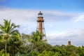 Scenic view of lighthouse on Sanibel Island with blue sky and puffy white clouds Royalty Free Stock Photo