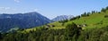 a scenic view of a little village and green meadows in Austrian Alps of Schladming-Dachstein region (Austria) Royalty Free Stock Photo